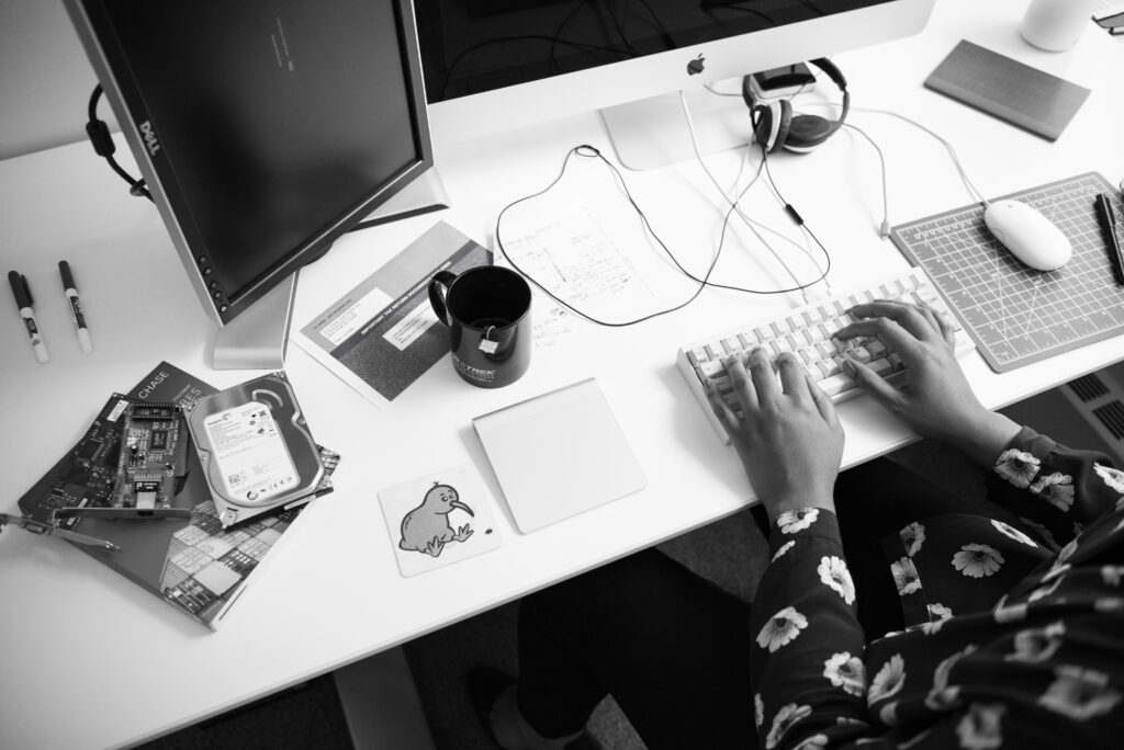 Woman working at her computer, moving past the fear of failing again.